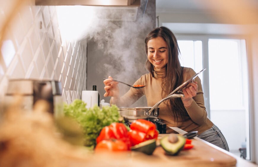 Woman cooking at kitchen